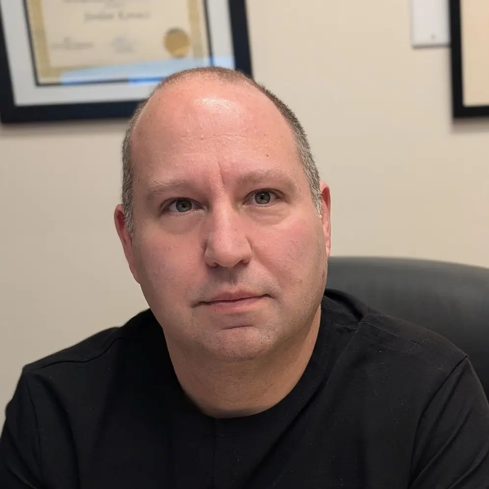 Headshot of Dr. Jordan Kovacs, chiropractic physician